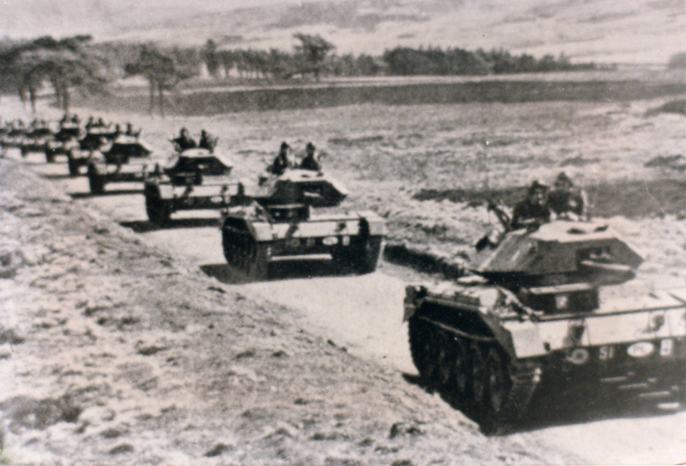 Poles, tanks heading up teh road from Whiteadder valley.jpg